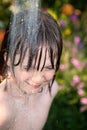 Child hosepipe water summer garden splash Royalty Free Stock Photo