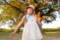 Child and a huge tree in the forest. old oak and a little girl Royalty Free Stock Photo