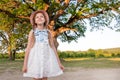 Child and a huge tree in the forest. old oak and a little girl Royalty Free Stock Photo