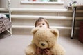 Child hugging teddy bear, devotion concept, kid hiding behind the toy Royalty Free Stock Photo