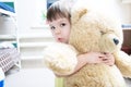 Child hugging teddy bear Royalty Free Stock Photo