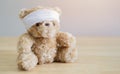The child is hurt. Teddy bear with bandage sit on wooden table with space for text Royalty Free Stock Photo