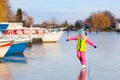 Child ice skating on frozen mill canal in Holland. Royalty Free Stock Photo