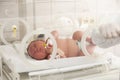 A child in an incubator. Neonatal and Premature Intensive Care Unit Royalty Free Stock Photo