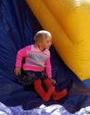 Child on inflatable slide Royalty Free Stock Photo