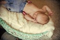 Child in jeans asleep in basket Royalty Free Stock Photo