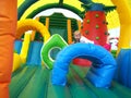 Child jumping in bouncy castle