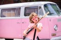 Child jumping, excited little rock guitarist with guitar. Royalty Free Stock Photo