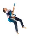 Child jumping with a guitar Royalty Free Stock Photo