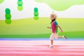 Child jumping on playground trampoline. Kids jump. Royalty Free Stock Photo