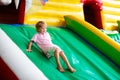 Child jumping on playground trampoline. Kids jump Royalty Free Stock Photo