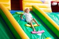 Child jumping on playground trampoline. Kids jump Royalty Free Stock Photo