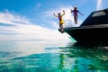 Child jumping into sea water. Yacht vacation Royalty Free Stock Photo