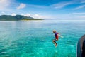 Child jumping into sea water. Yacht vacation Royalty Free Stock Photo