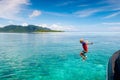 Child jumping into sea water. Yacht vacation Royalty Free Stock Photo