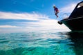 Child jumping into sea water. Yacht vacation Royalty Free Stock Photo