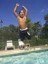 Child jumping in swimming pool Royalty Free Stock Photo