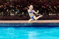 Child jumping in swimming pool. Kids swim Royalty Free Stock Photo