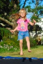 Child jumping trampoline Royalty Free Stock Photo