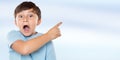 Child kid amazed surprised little boy pointing on ad advertising with copyspace copy space Royalty Free Stock Photo