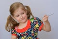 Child, kid, baby little girl  doesn`t want to eat broccoli. Royalty Free Stock Photo