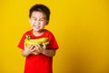 Child or kid cute little boy attractive smile playing holds bananas comb fruit Royalty Free Stock Photo