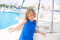 Child kid girl in marina boat on summer vacations