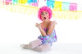 Child kid girl with party clown pink wig funny expression Royalty Free Stock Photo