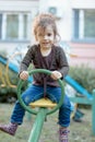 Child kid girl swinging on a playground swing Royalty Free Stock Photo
