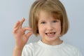 Child, kid, shows the fallen baby tooth. Royalty Free Stock Photo