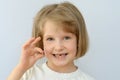 Child, kid, shows the fallen baby tooth. Royalty Free Stock Photo