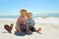 Child Kissing Brother on Beach Royalty Free Stock Photo