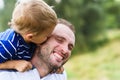 Child kissing father Royalty Free Stock Photo