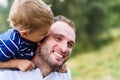 Child kissing father Royalty Free Stock Photo