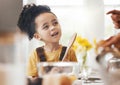 Child in kitchen, baking and learning with parent, wooden spoon and cake flour on face, little baker making breakfast or Royalty Free Stock Photo