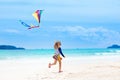 Child with kite. Kids play. Family beach vacation. Royalty Free Stock Photo