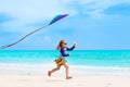 Child with kite. Kids play. Family beach vacation. Royalty Free Stock Photo