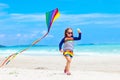 Child with kite. Kids play. Family beach vacation. Royalty Free Stock Photo