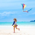 Child with kite. Kids play. Family beach vacation Royalty Free Stock Photo