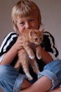 Child and kitten Royalty Free Stock Photo