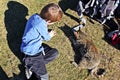 Child and kitten playing on the ground