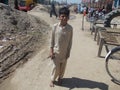 Child labour - small boy going for day work in Pakistani Village