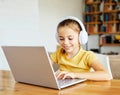 child laptop computer technology home girl education homework kid learning internet childhood student sitting connection Royalty Free Stock Photo