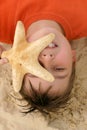 Child with a large starfish Royalty Free Stock Photo