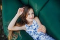 A child lays on a resting on an air sofa in the forest. Lamzac. Travel, family vacation in the forest in summer