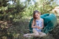 A child lays on a resting on an air sofa in the forest. Lamzac. Travel, family vacation in the forest in summer Royalty Free Stock Photo