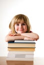 Child leaning on books Royalty Free Stock Photo