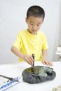 A child learning Chinese Calligraphy Royalty Free Stock Photo