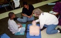 2 CPR instructors are teaching CPR in a community CPR class in Greenbelt, Md
