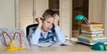 Child with learning difficulties. Tired boy doing homework. Education. Royalty Free Stock Photo